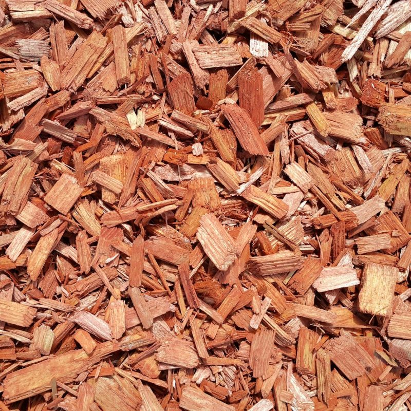 Natural background of red mulch, close up photo